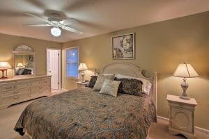 a bedroom with a bed and a ceiling fan at Spacious Family Home - 17 Miles to Winston-Salem! in Lewisville