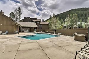 a swimming pool on a patio with a house and a mountain at Ski Shuttle and Mountain Views Keystone Resort Home in Keystone