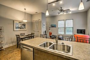 a kitchen and living room with a sink and a counter at Heart of the Brooklyn Arts District Urban Gem! in Wilmington
