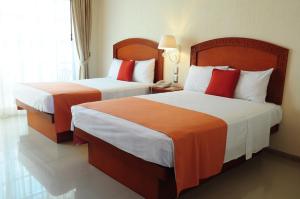 Postel nebo postele na pokoji v ubytování Posada Sian Kaan Playa del Carmen - Wellness Oriented Hotel