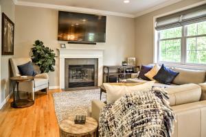 a living room with a couch and a fireplace at Colonial-Style Warwick Retreat - 1 Hour to NYC! in Warwick