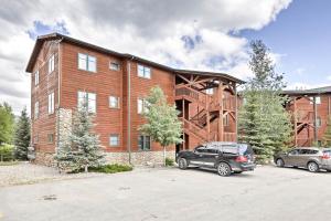 a large brick building with cars parked in front of it at 7 Mi to National Park Grand Lake Condo with Deck! in Grand Lake
