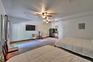 a bedroom with a bed and a ceiling fan at Lava Hot Springs Studio - Walk to Portneuf River! in Lava Hot Springs