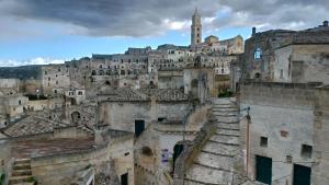 a view of an old city with a castle at Casa 3Bien in Matera
