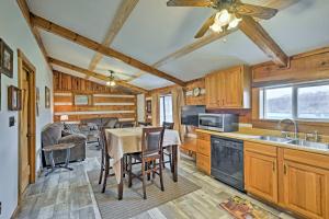 a kitchen and dining room with a table and chairs at Rogersville Barn Apartment on 27 Acres with Pond! in Rogersville