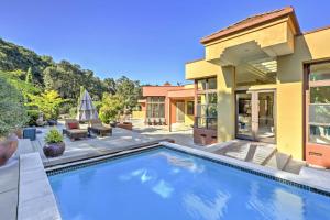 a swimming pool in the backyard of a house at Chic California Escape with Pool, Hot Tub and Patio! in Salinas