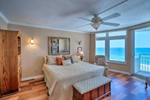 a bedroom with a bed and a ceiling fan at Waterfront Daytona Beach Shores Condo with Amenities in Daytona Beach Shores +17 photos