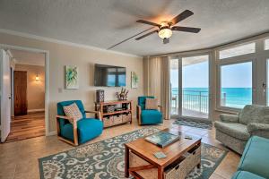 a living room with a view of the ocean at Waterfront Daytona Beach Shores Condo with Amenities in Daytona Beach Shores