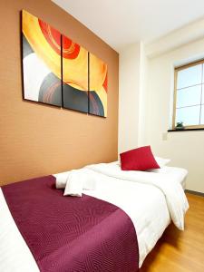 Ένα ή περισσότερα κρεβάτια σε δωμάτιο στο OUCHI HOTEL Yokogawa