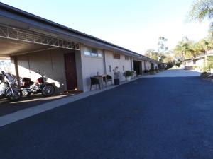 a motorcycle parked in front of a building at Dalby Parkview Motel in Dalby