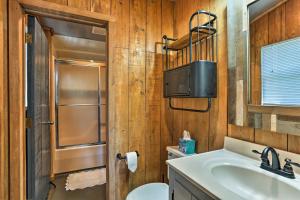 a bathroom with a sink and a toilet and a mirror at Outer Banks Island Cottage - 1 Mi to Frisco Beach! in Frisco +20 photos