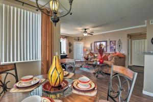 a kitchen and living room with a table and chairs at Ground-Floor Poolside Mesa Condo with Luxe Amenities in Mesa