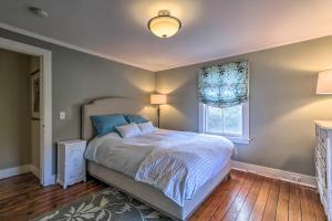a bedroom with a bed and a window at Cozy Litchfield House with Fenced-In Yard and Fire Pit in Litchfield