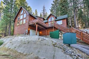 a wooden house on a hill in the woods at Home with Indoor Pool in South Lake Tahoe! in South Lake Tahoe