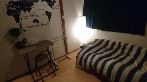 Postel nebo postele na pokoji v ubytování UNLOCK SAKAI + 15 fotografií