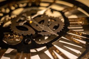 a close up of a black and gold clock at LifeHouse IPPO in Otaru