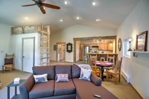 a living room with a couch and a kitchen at Semi-Private Mancos Cabin on 80 Acres with Mtn View! in Dolores