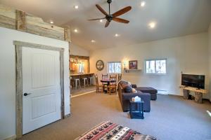 a living room with a couch and a ceiling fan at Semi-Private Mancos Cabin on 80 Acres with Mtn View! in Dolores