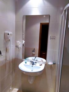 a bathroom with a sink and a mirror at Studio Villa Park 207 in Borovets