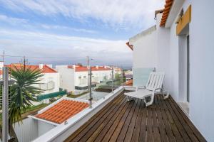 En balkon eller terrasse på Casa Papagaios