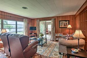 a living room with a couch and a chair at Historic Lakefront Gem about 6 Mi to Bok Tower Gardens in Lake Wales