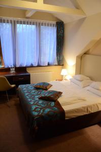 מיטה או מיטות בחדר ב-Agat Hotel