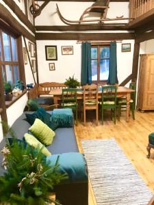 a living room with a couch and a table at Chalupa Pod Skalou II. in Paseky nad Jizerou