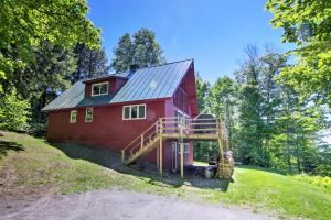 a red barn with a ramp leading up to it at East Burke House with Deck Less Than 3 Mi to Kingdom Trails! in East Burke