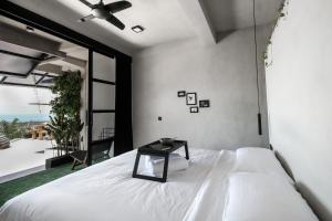 Postel nebo postele na pokoji v ubytování OCEANNA - Uluwatu, Bali