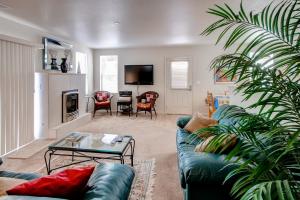 a living room with a couch and a table at Serene Bungalow-Style Home in Point Reyes Station! in Point Reyes Station