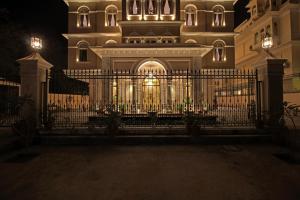 a building with a gate in front of it at night at Jhadol Vijay Vilas Near Lake Pichola in Udaipur
