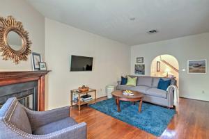 a living room with a couch and a fireplace at Home 5 Mi to Colonial Pkwy, 11 Mi to Busch Gardens in Williamsburg