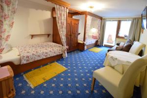 Postel nebo postele na pokoji v ubytování Romantik Aparthotel Sonnleitn