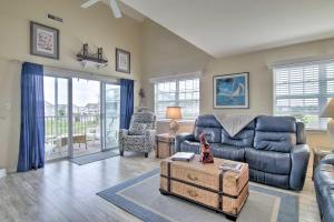 a living room with a couch and a table at Ocean View Condo by Bethany Beach with Balcony! in Ocean View
