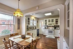a kitchen with a wooden table and a dining room at Central Wadesboro Home Walk to Downtown Shops! in Wadesboro