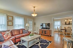 a living room with a couch and a table at Central Wadesboro Home Walk to Downtown Shops! in Wadesboro