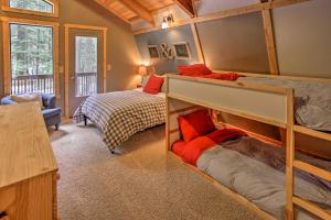 a bedroom with two bunk beds in a cabin at Mountain Chalet with Hot Tub by Cle Elum Lake! in Cle Elum