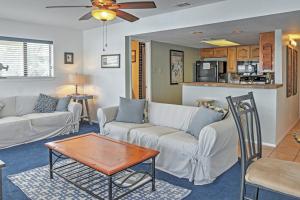 a living room with a couch and a table at Spicewood Condo on The South Shore of Lake Travis! in Spicewood