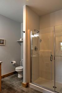 a bathroom with a shower and a toilet at Columbia Falls Vacation Rental Near Flathead River in Columbia Falls