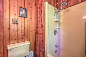 a bathroom with a toilet and a shower in a room at Walk to River! Its A Wonderful Life Cottage in Bellevue +17 photos