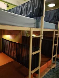 a bunk bed in a dorm room at Sleep Tight Hostel at Koh Phangan in Haad Rin