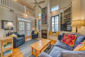 a living room with two couches and a table at Seaside in Santa Rosa Beach