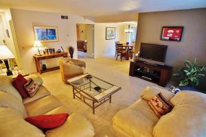 a living room with two couches and a television at Phoenix Abode with Pool Access Walk to Fashion Park in Phoenix