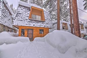 a house with a pile of snow in front of it at Private Deck and Community Pool Incline Village Gem in Incline Village