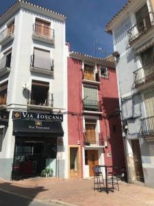 a row of tall buildings in a street at Segunda casa de Ana Lucia en la playa in Villajoyosa