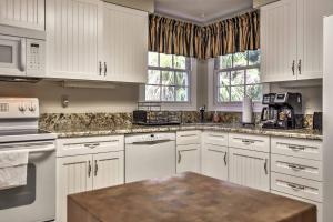 a kitchen with white cabinets and white appliances at Hilton Head Island Villa On Golf Course! in Hilton Head Island