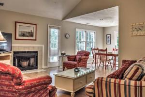 a living room with couches and a fireplace at Hilton Head Island Villa On Golf Course! in Hilton Head Island