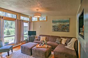 a living room with a couch and a table at Scenic Lead Cabin Steps to Terry Peak Ski Area! in Lead