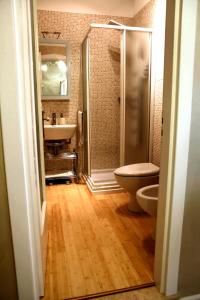 a bathroom with a shower and a toilet and a sink at A Class in Lecce