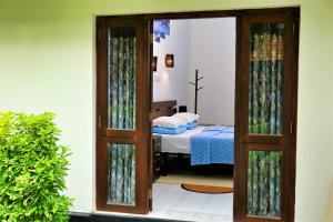 Postel nebo postele na pokoji v ubytování Camellia Dwelling